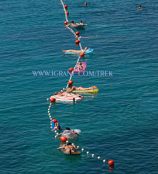 bather forming line in the sea